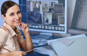 Woman smiling at desk with design portfolio on screen and fabric and wallpaper on desk