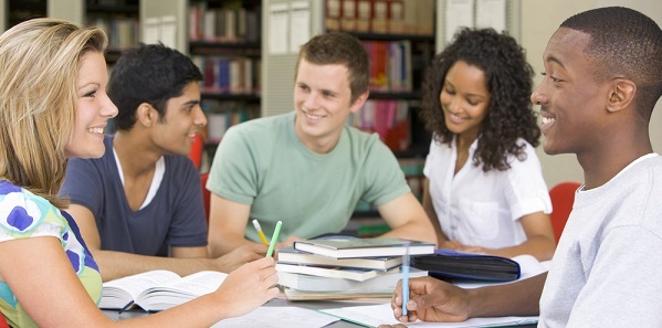 group of students studying around a table