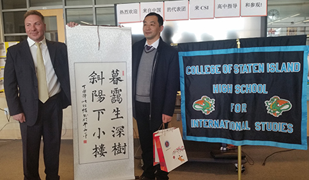 Mr.Yiming Dong, Dean of the Niulanshan First Secondary School, Beijing, China presented a Chinese poietic calligraphy scroll wrote by his students to Mr. Joseph Canale, Esq., Principal, College of Staten Island High School for International Studies.