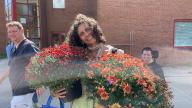 Faculty and Staff with colorful Mums' Planters