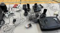 Table with electronics and video games systems