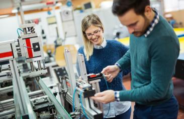 Student Using Advanced Machinery