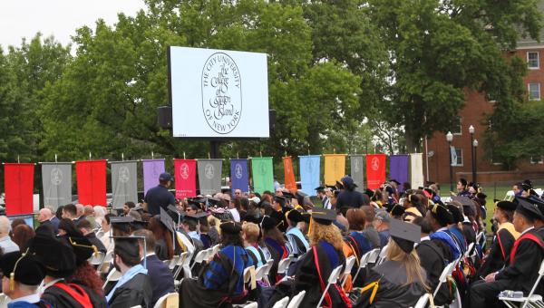 commencement ceremony at CSI, colorful flags of the departments