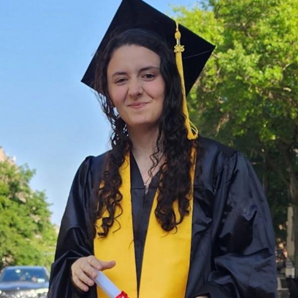 photo of Katherine Yenna in graduation cap and gown