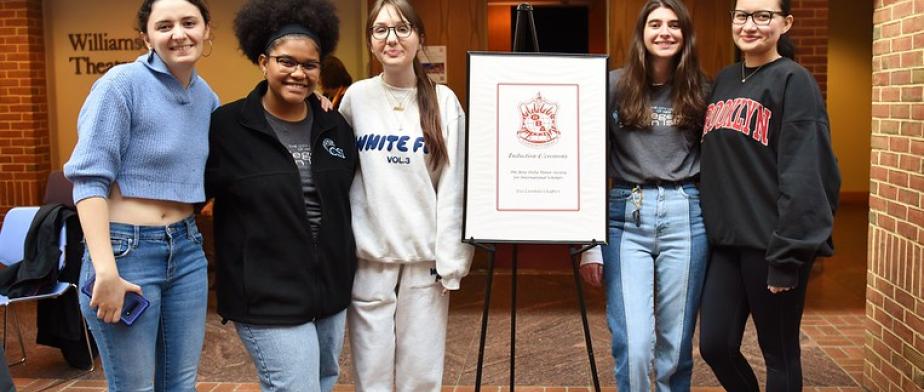Phi Beta Delta Honor Society Students group of 5 students with PBD Logo