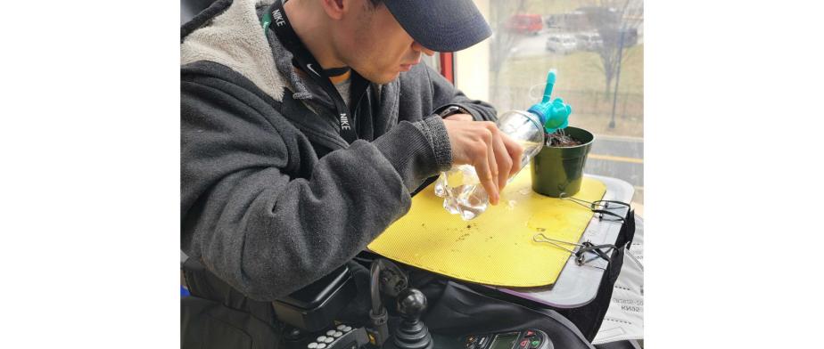 A person in a wheelchair pouring a drink