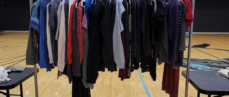 Clothes on hanging rack at the Stop and Swap event Clothes on hanging rack