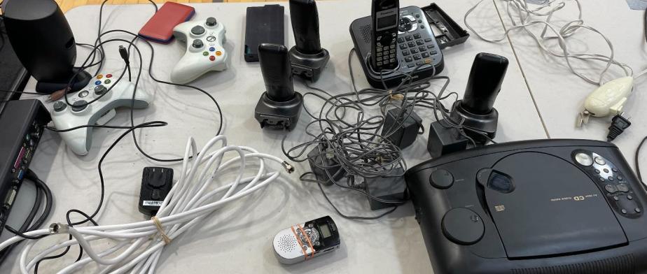 Table with electronics and video games systems at the Stop and Swap event Table with electronics and video games systems