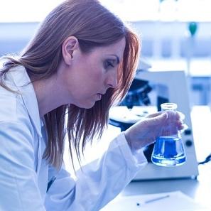 Health wellness female lab student with laptop image