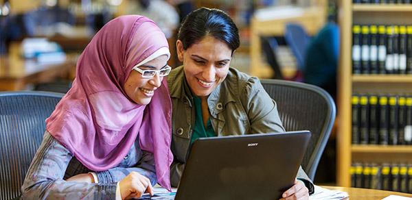 two females in library