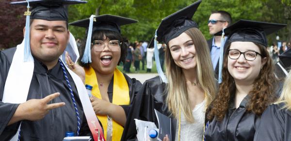 Graduating CSI students cheerfully celebrating