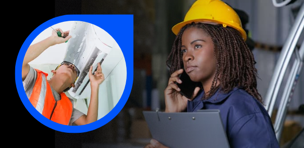 a woman working on air condition unit with a woman on worksite smiling