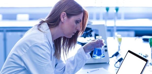 Health wellness female lab student with laptop image