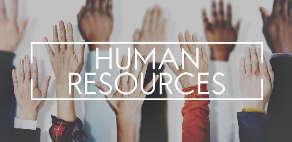 Human Resources signage and hands raised