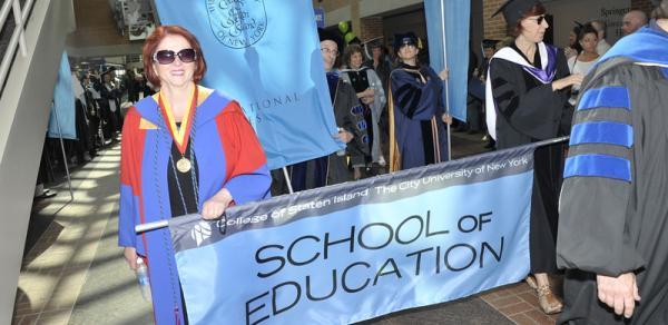 SOE faculty with banner