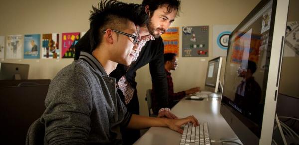 Student Being Instructed on Computer