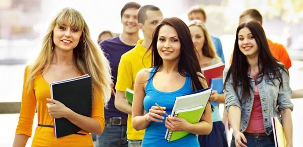 Students Holding Books Posing