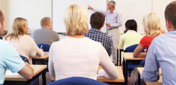 classroom with stduents and  teacher in front of class