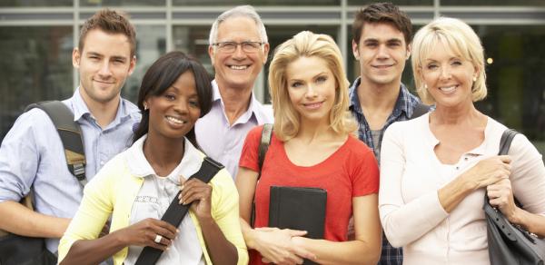 Group of students outside a building posing for a picture