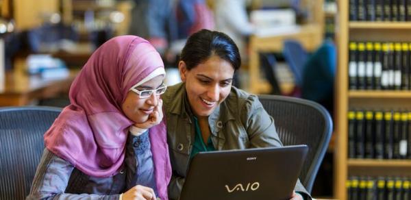 2 females in library