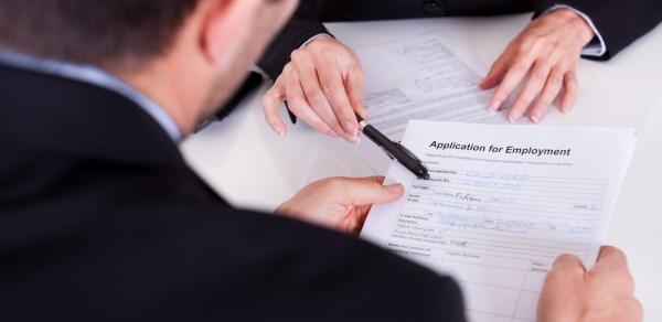 Men at table reviewing documents