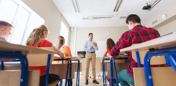 Teacher at the front of classroom