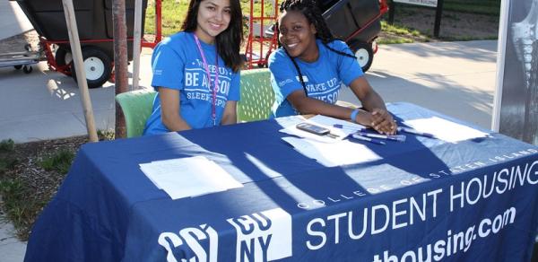 Two students at table CSI schlolarships