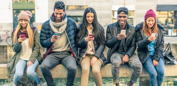 student sitting together on a bench