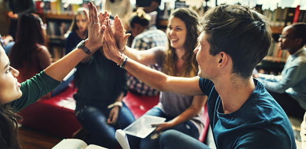 Students In Group High Fives