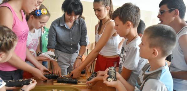 Volunteer making Korea Sushi with children, Eastern Europe