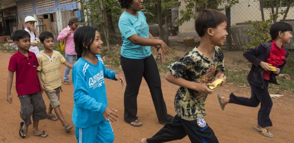 Volunteer with children in Cambodia