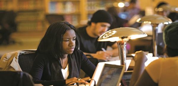 Student studying in campus library