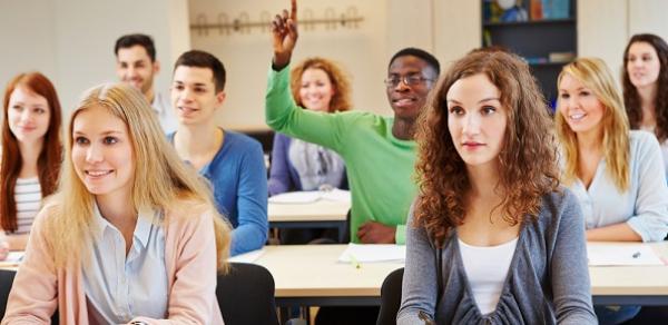 Student Raising His Hand In Class