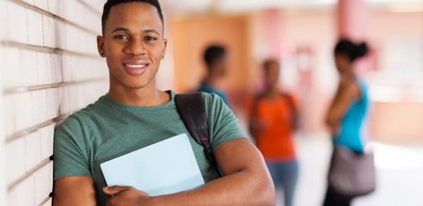 Student Leaning Against Wall