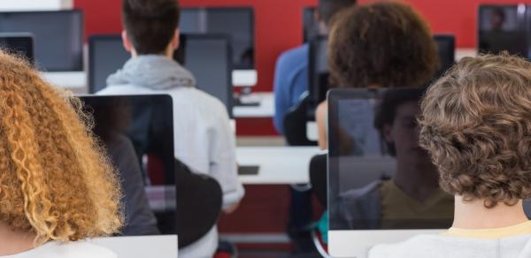 Students In Class Working On Computers