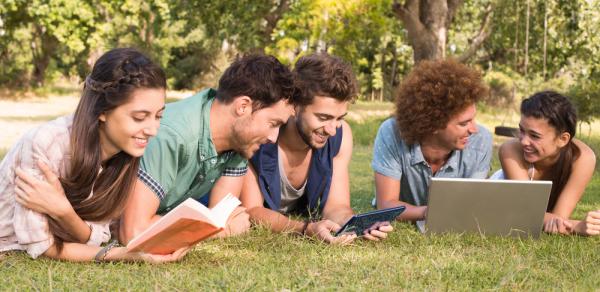 Students Laying Out On The Grass