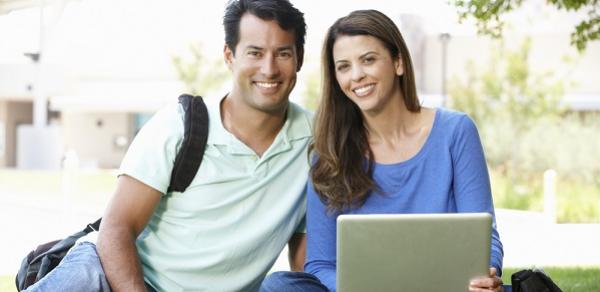 Two Students Posing Outside