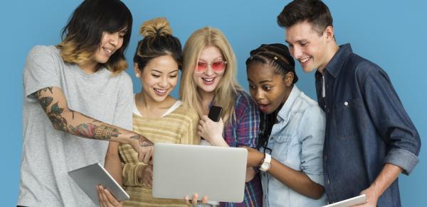 students around laptop