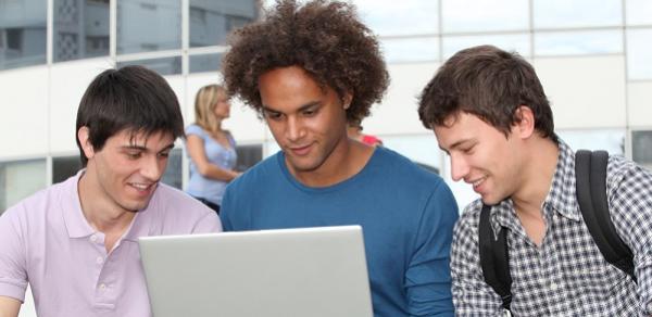 Students viewing laptop