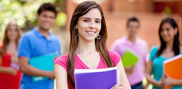 Student Holding Books Outside