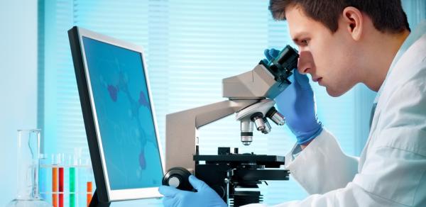 Student Looking Through Microscope