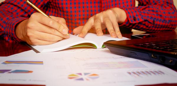 Student Working In Notebook