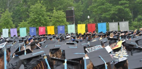 Students Celebrating Commencement on the Great Lawn