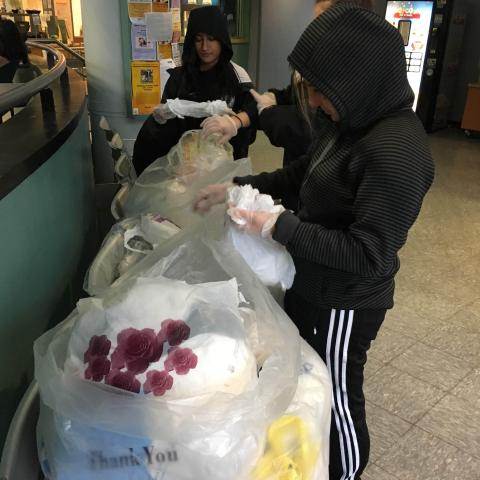 Students are counting the number of bags dropped off at our bag drive