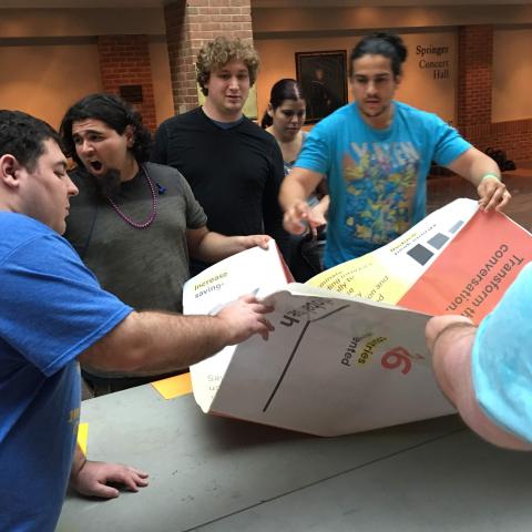 Students prepare to fold the giant origami at 1P