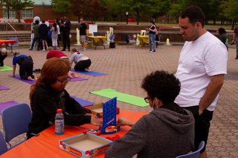 Students are engaged in outdoor Daylight Hour activities such as games, yoga, class with Danny and art.​