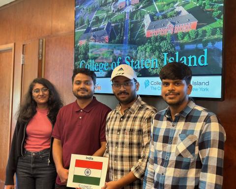 Four Students With a Picture of the Flag of India
