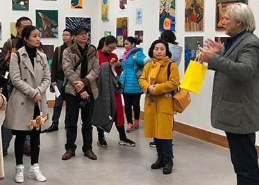 A delegation from Guangdong Teachers College group of people at the art exhibition