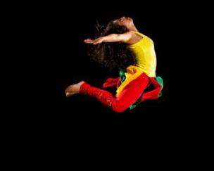 A Woman Dancing In Mid Air A Woman Dancing In Mid Air