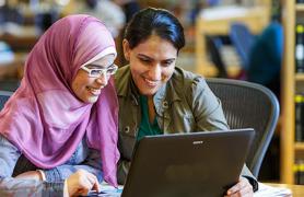 two females in library